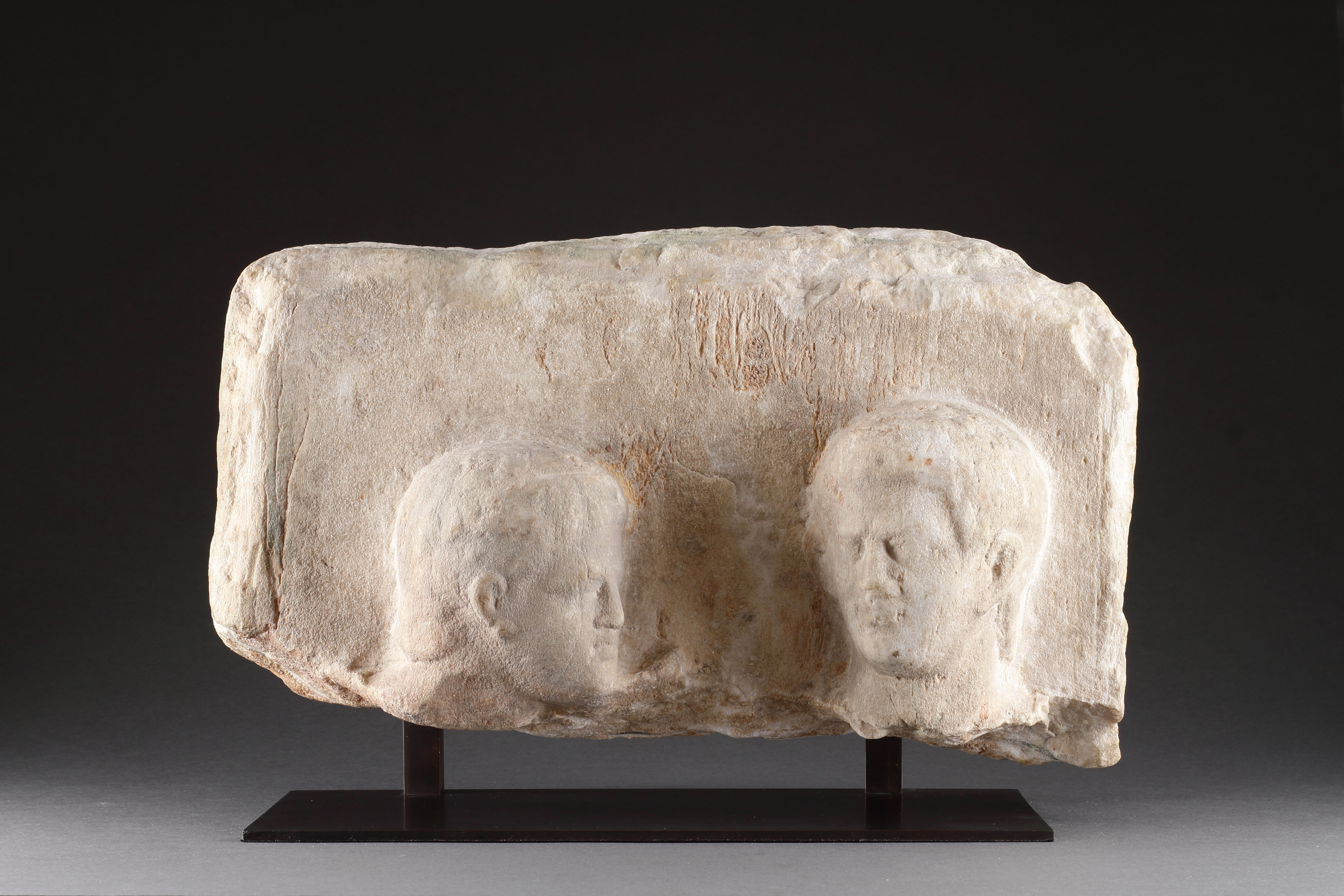 A Hellenistic Funerary Stele in High Relief with Two Male Heads